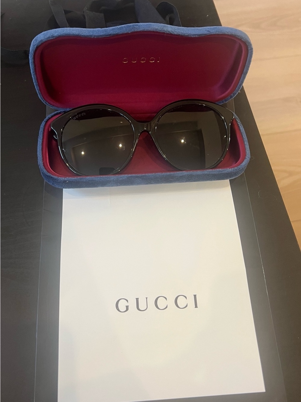 Gucci Black Round Women's Sunglasses with Dark Lenses.